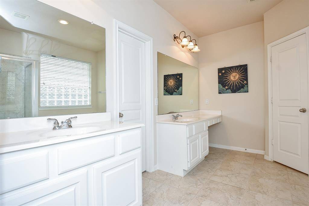 What a nice view of walk-in shower and bathtub reflected in wall wide mirrors.