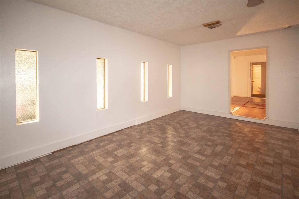 Spacious den seamlessly connected to the living area, originally a garage conversion.