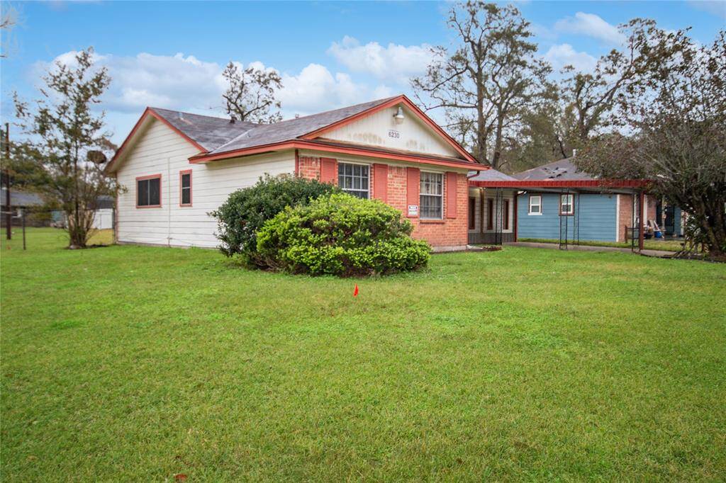 Expansive corner lot with a spacious backyard perfect for outdoor living.
