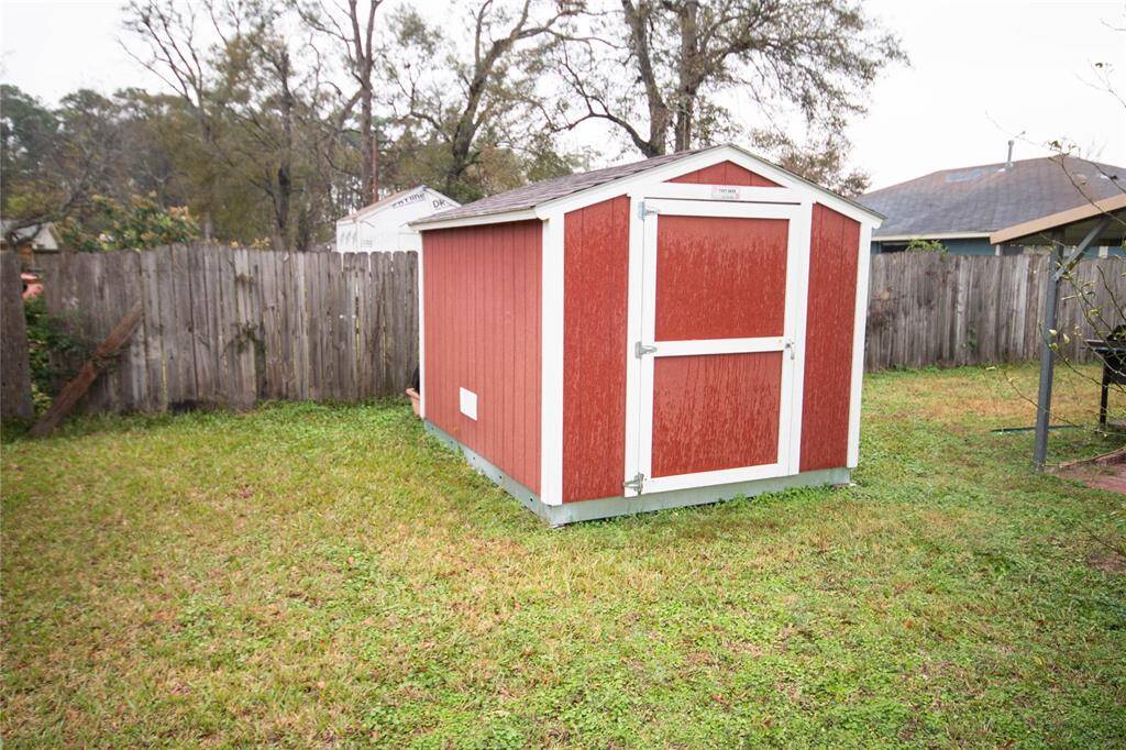Charming backyard storage shed, perfect for organizing tools and outdoor equipment.