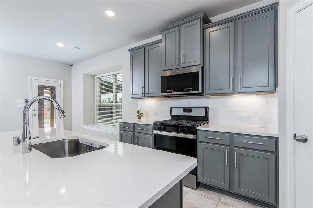 Under cabinet lighting and oversized cabinets
