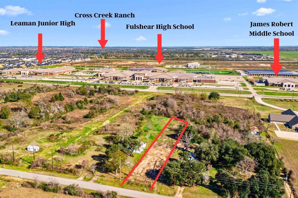 This view faces east, showcasing another perspective of the schools and the expansive Cross Creek Ranch development. Please note that the property outline is approxmate.