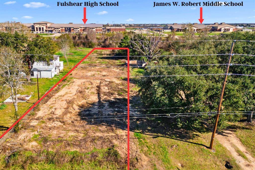 A closer look at the 0.84-acre lot highlights its prime location and potential for development. Please note that the property lines are approximate.