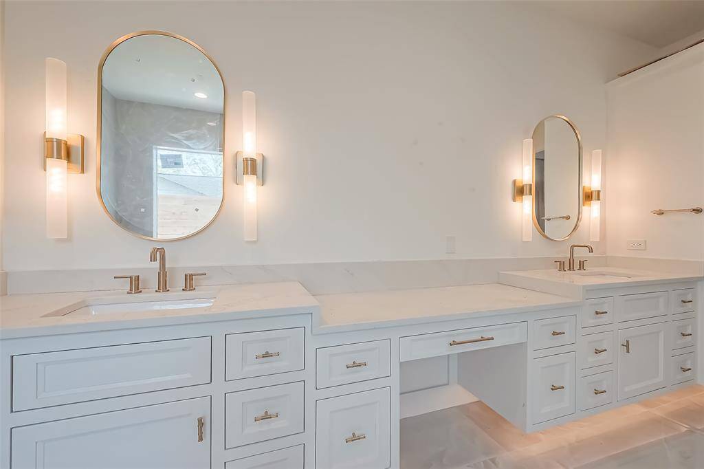 Primary Bathroom Lavish floor-to-ceiling tile for a spa-like ambiance. Photos as of 03/20/2025.