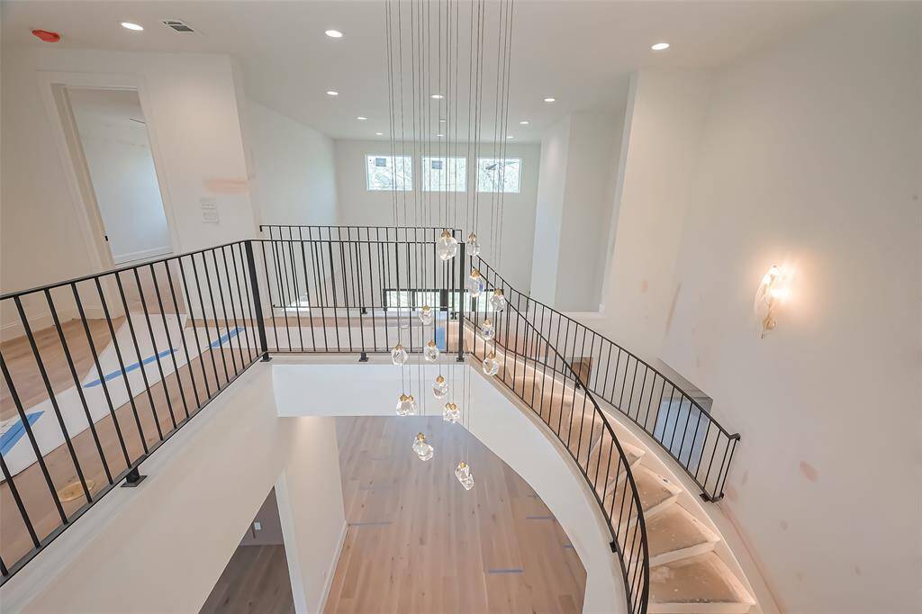 Stunning Spiral Staircase with Custom Wrought Iron Railing & LED Lighting. Photos as of 03/20/2025.