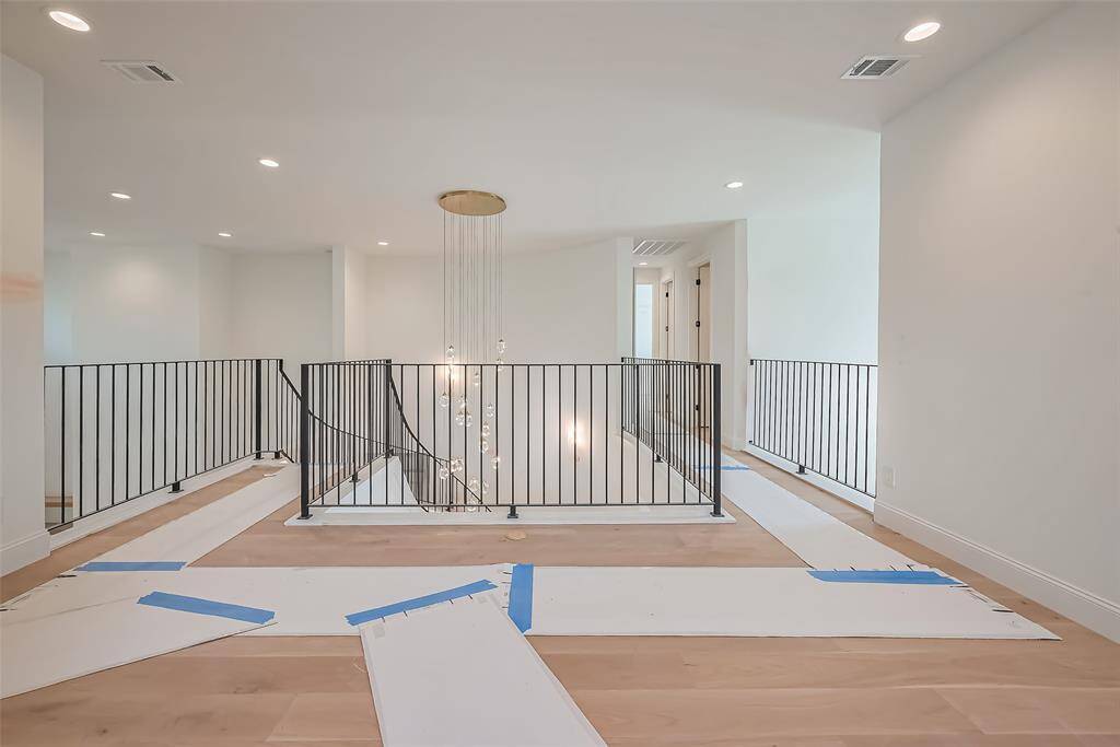 Stunning Spiral Staircase with Custom Wrought Iron Railing & LED Lighting. Photos as of 03/20/2025.