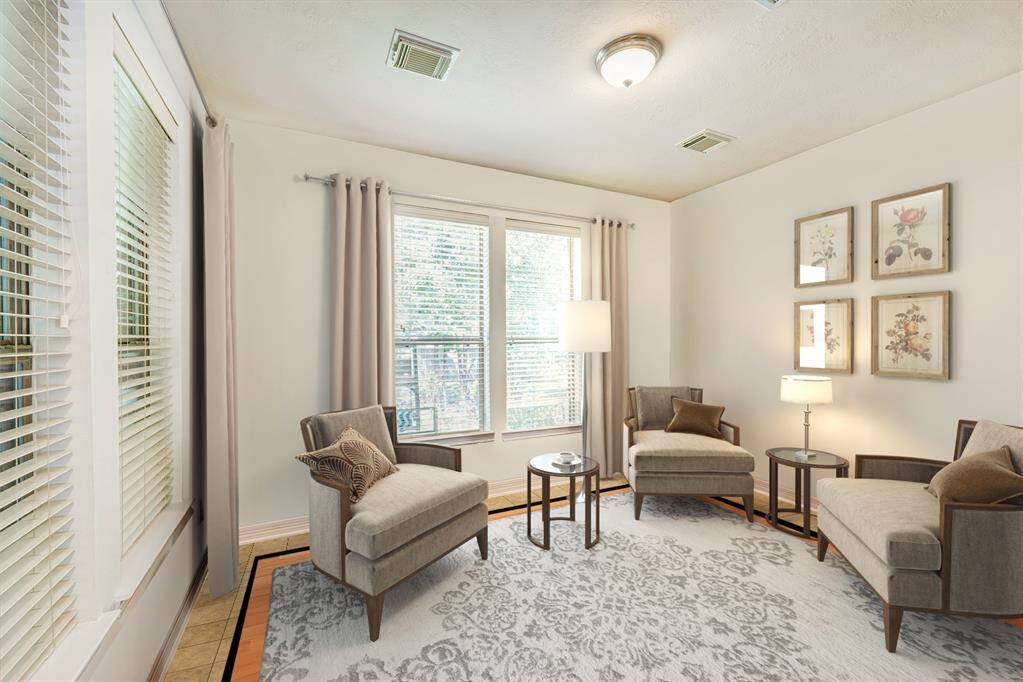 Located just off the rear entry, this flex space can be a second office, craft room, den, or a 6th bedroom. A full bath is to the right of the photo. Photo is virtually furnished.