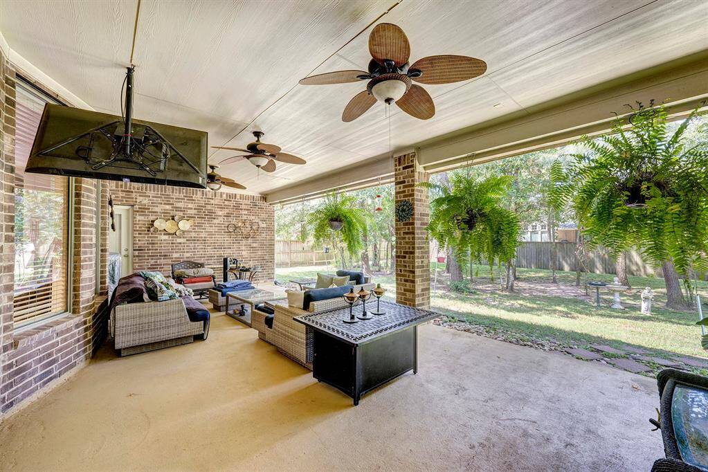 Unwind on the covered back patio. Oversized to allow for dining and lounge areas for all seasons!