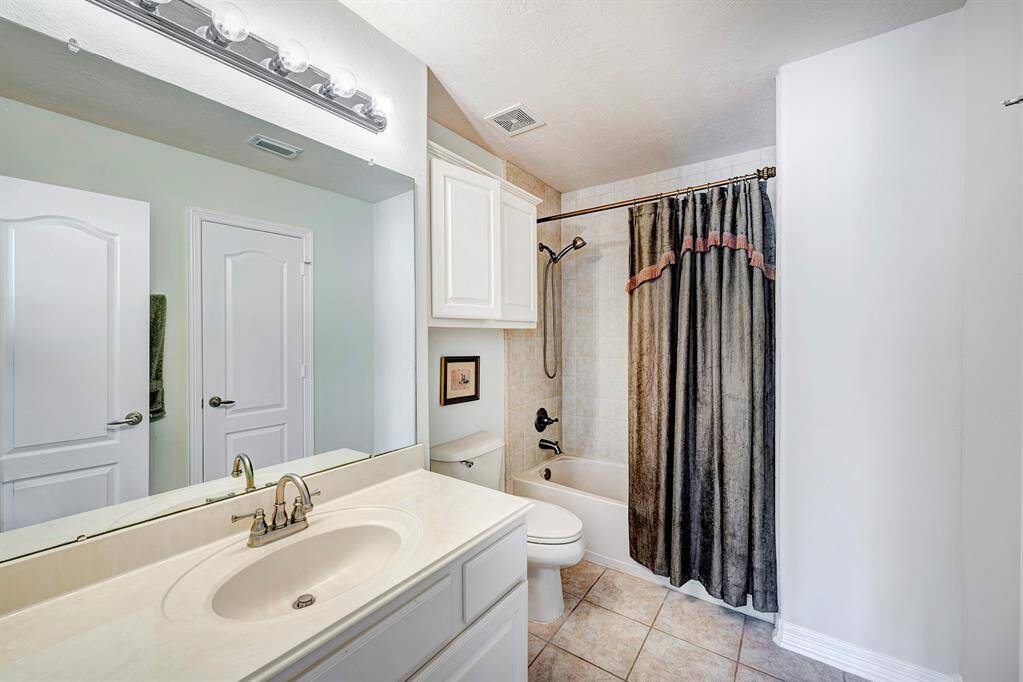One of three secondary full baths on the second floor.
