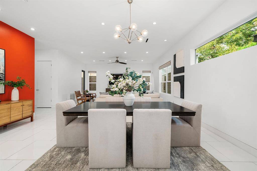 Alternate view from kitchen, looking towards dining/living. Notice the strategically placed windows like the one to the right that allows light to enter the dining area, yet still keeps the space private.