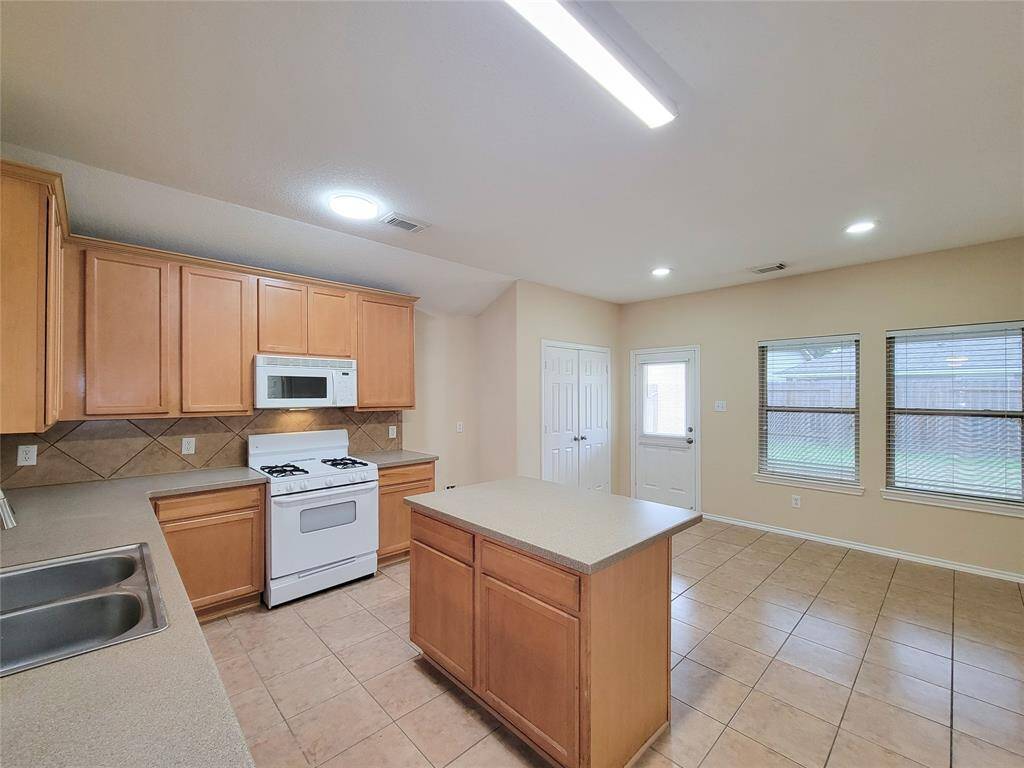 Open Style Kitchen with Island & lot of counter space.