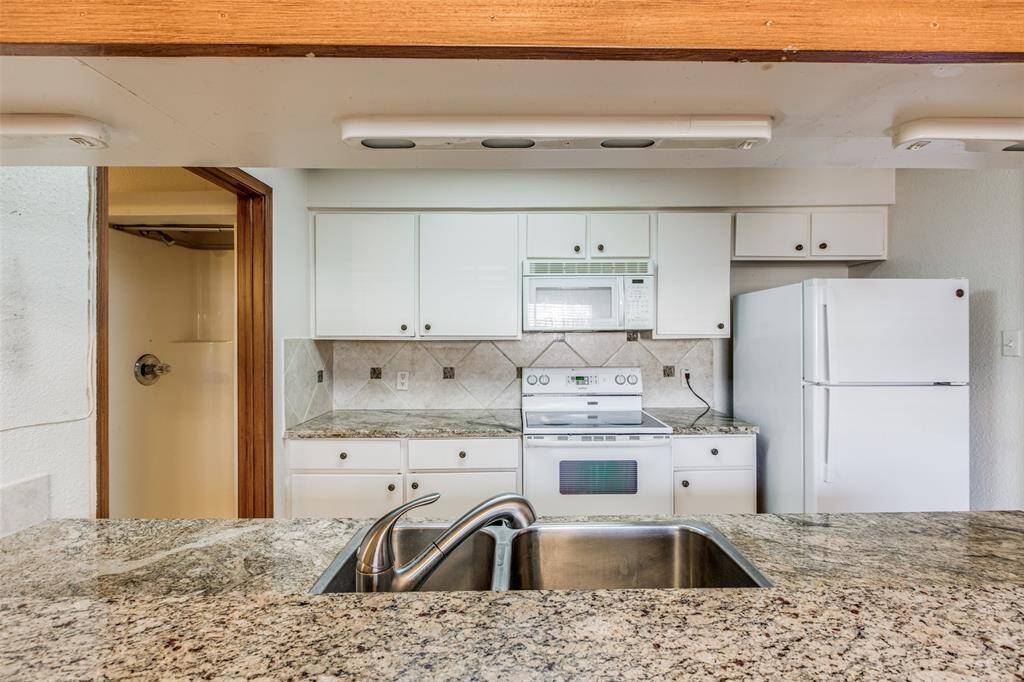 Beautiful appliances make cooking a pleasure in this gourmet kitchen.