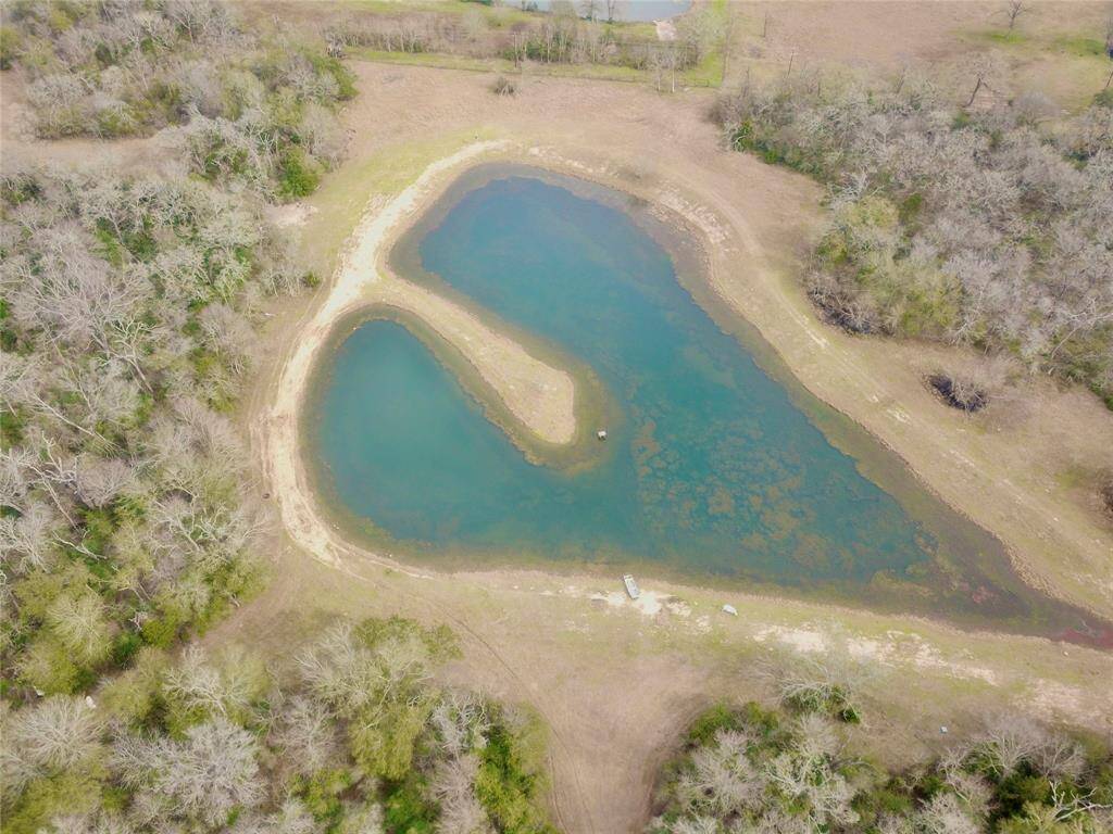 Ariel view of ~2 acre pond with bass and catfish