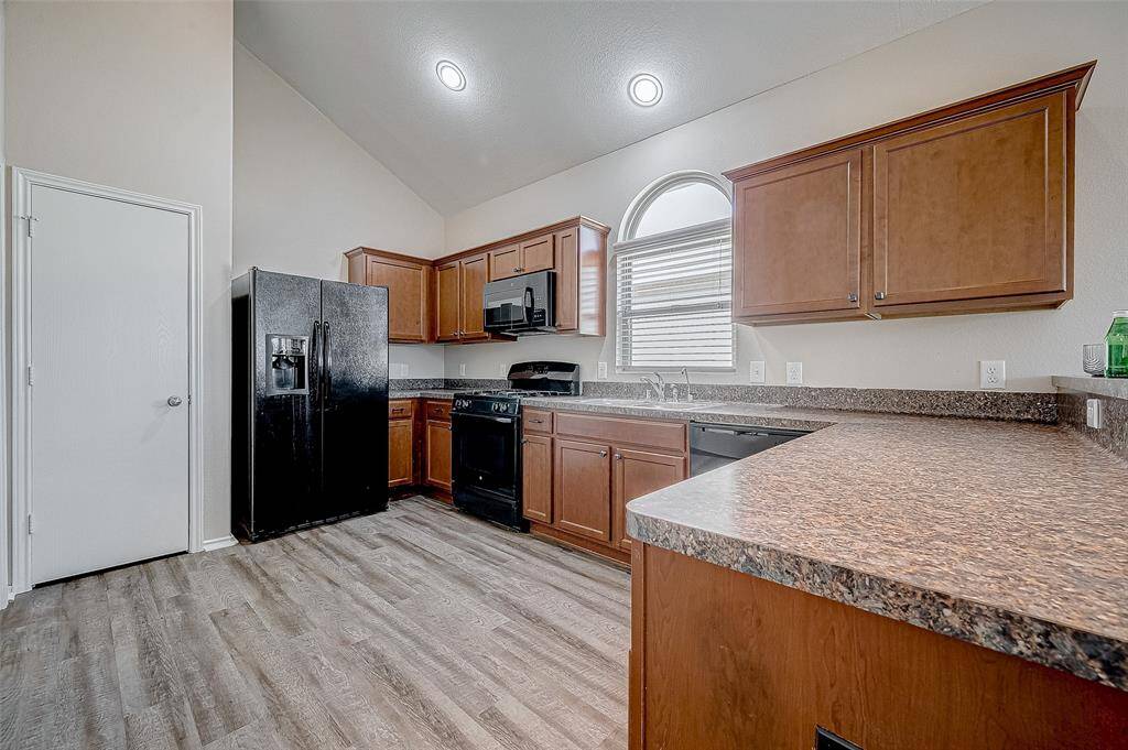 The durability of the BRAND-NEW Vinyl-Plank flooring enhances the functionality of the space.