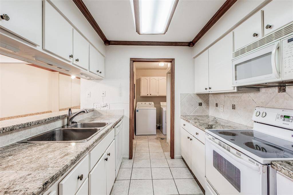 Beautiful cabinetry offers abundant storage, keeping your kitchen tidy and efficient.