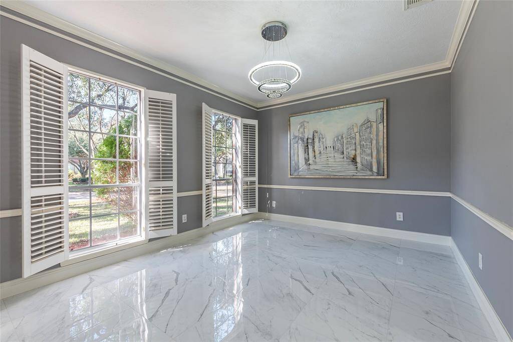 Easy and direct access to the kitchen is great for entertaining. Additional view of the spacious formal dining area.