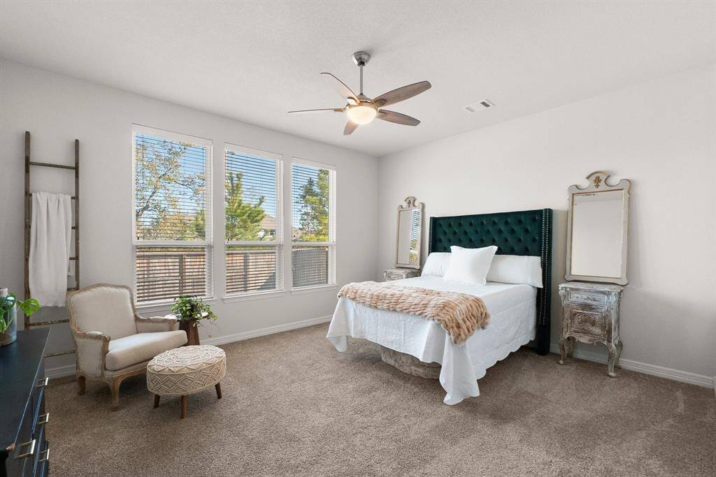 Oversized primary bedroom with high ceilings