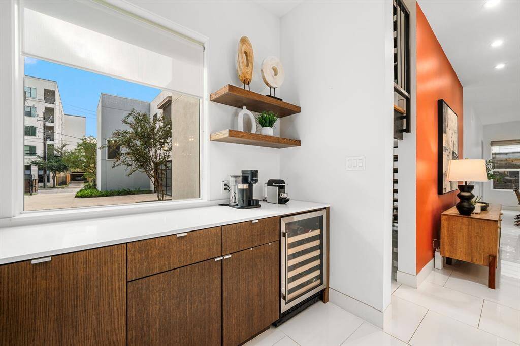 A beverage and coffee station make this home so easy to entertain in. The large panoramic window overlooks your driveway.