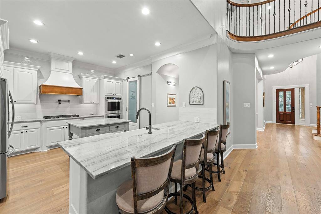Stunning Engineered hardwood floors on main level add luxury to this beautiful space