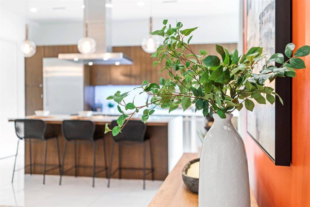 Take note of the designer fixtures throughout this home, including the fashionable pendants over the kitchen island.