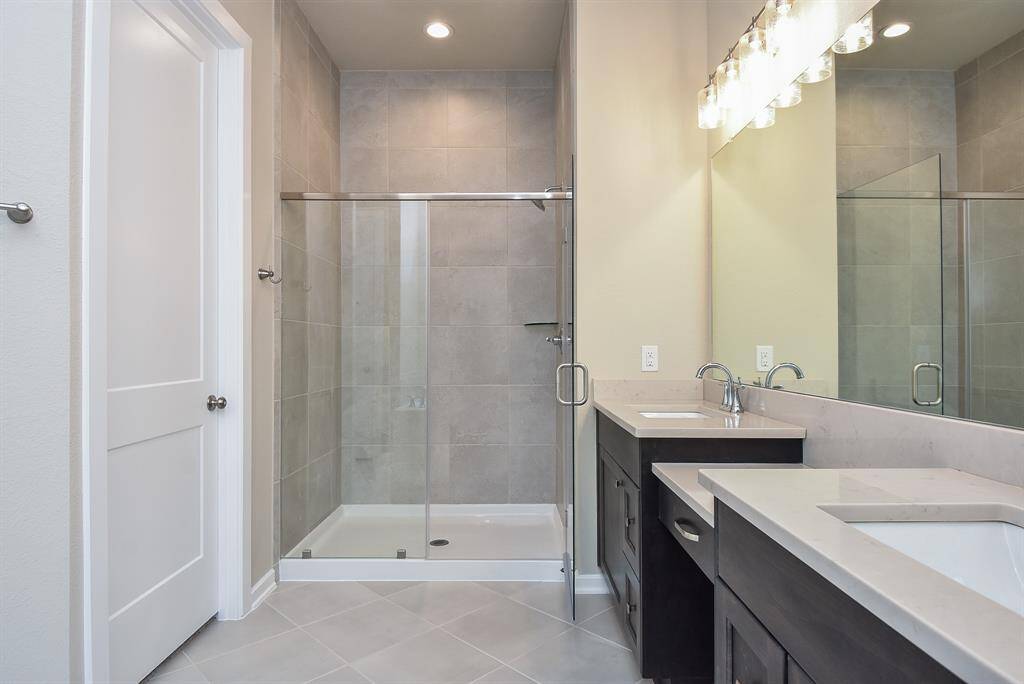 Double sinks and oversized shower