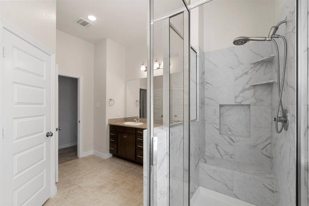 Walk in shower with updated tilework