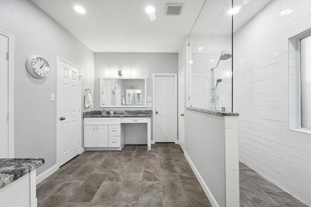 Primary bath with double vanities and extended shower