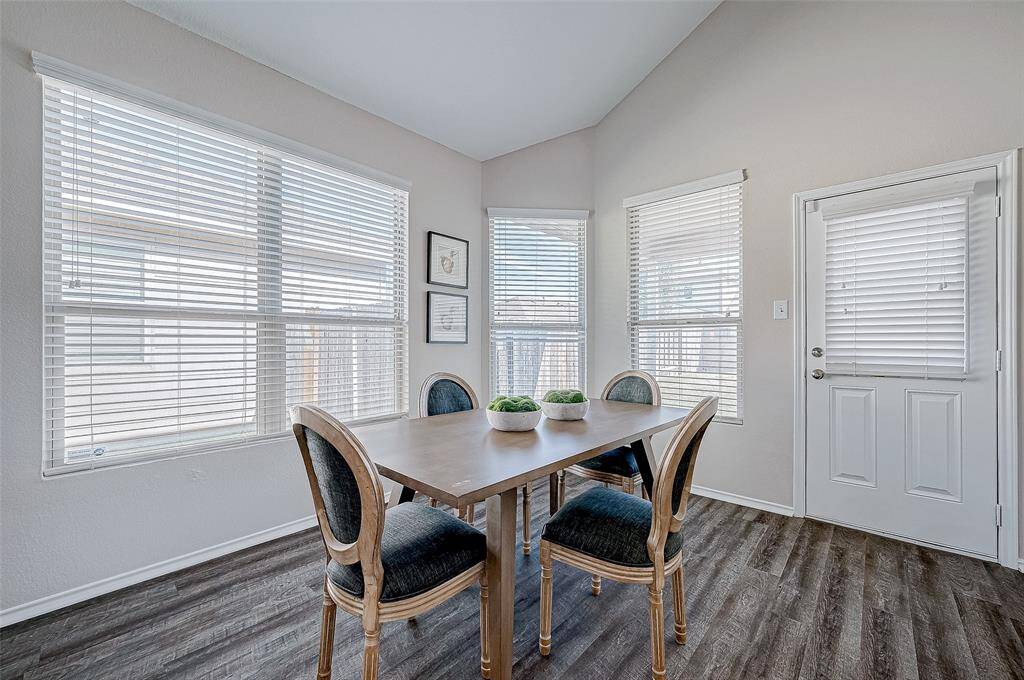 With easy access to the backyard through the adjacent door, this space is perfect for indoor and outdoor entertaining.