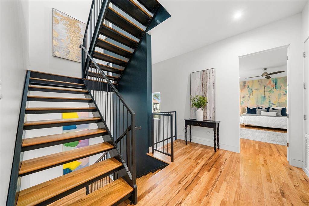 Welcome to the 2nd floor! This split floor plan offers the primary suite ahead, and 3 secondary bedrooms (not visible in this shot) in the other direction, with laundry in the middle.