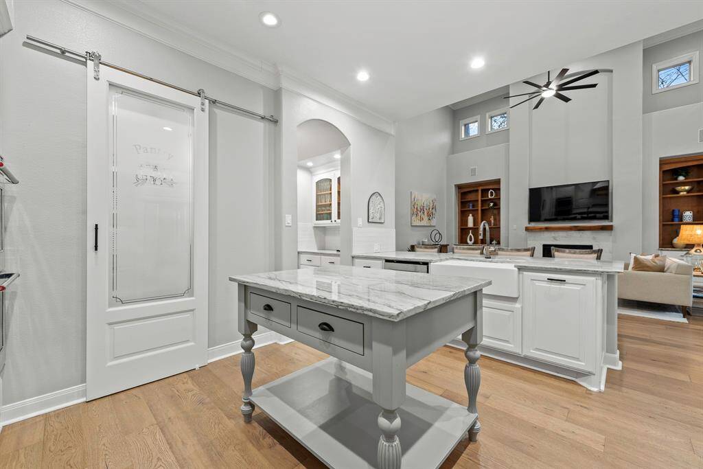 Pot filler, Thermador gas cooktop, updated vent a hood, are just a few updates to this beautiful kitchen