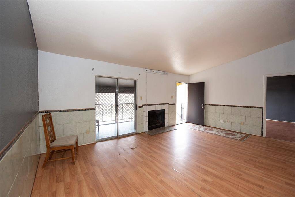 Living area has plenty of room for a large sectional sofa and room to spare.