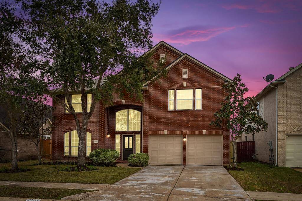 Twilight view of the beautiful front elevation!