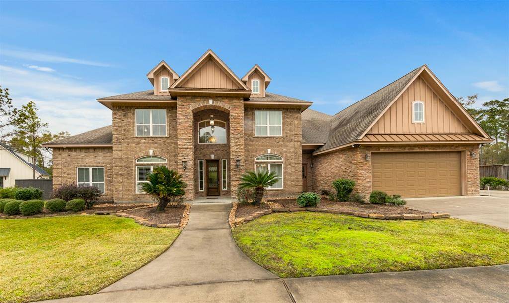 This impressive two-story brick home features a welcoming entry, large windows for natural light, and a spacious 3 car attached garage. The well-maintained landscaping and inviting walkway enhance its curb appeal.