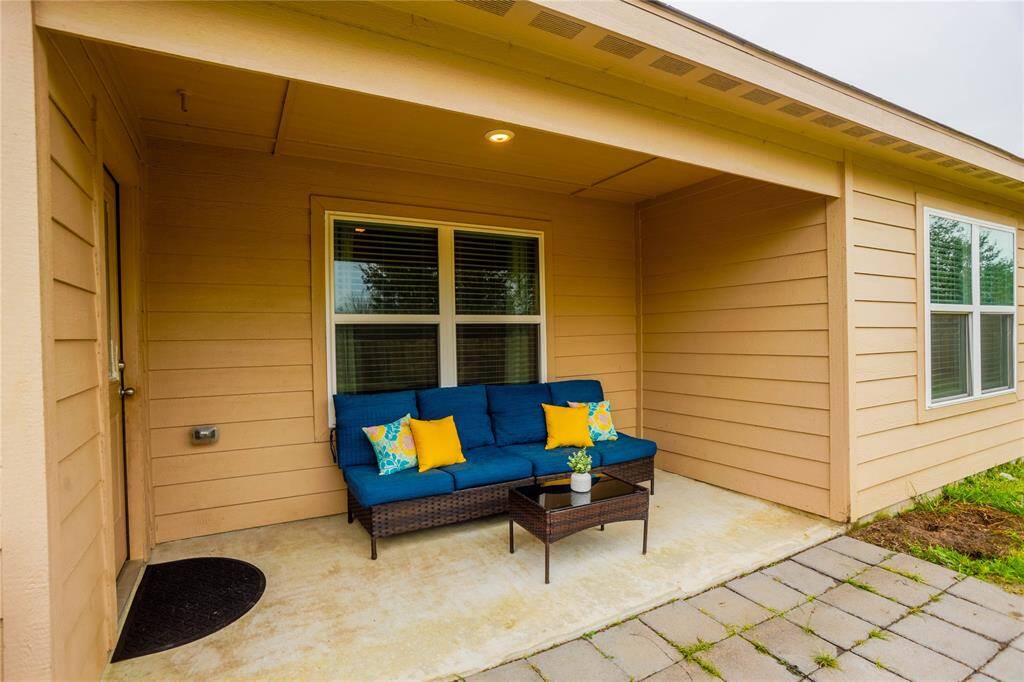 Covered back patio is the perfect place to unwind.