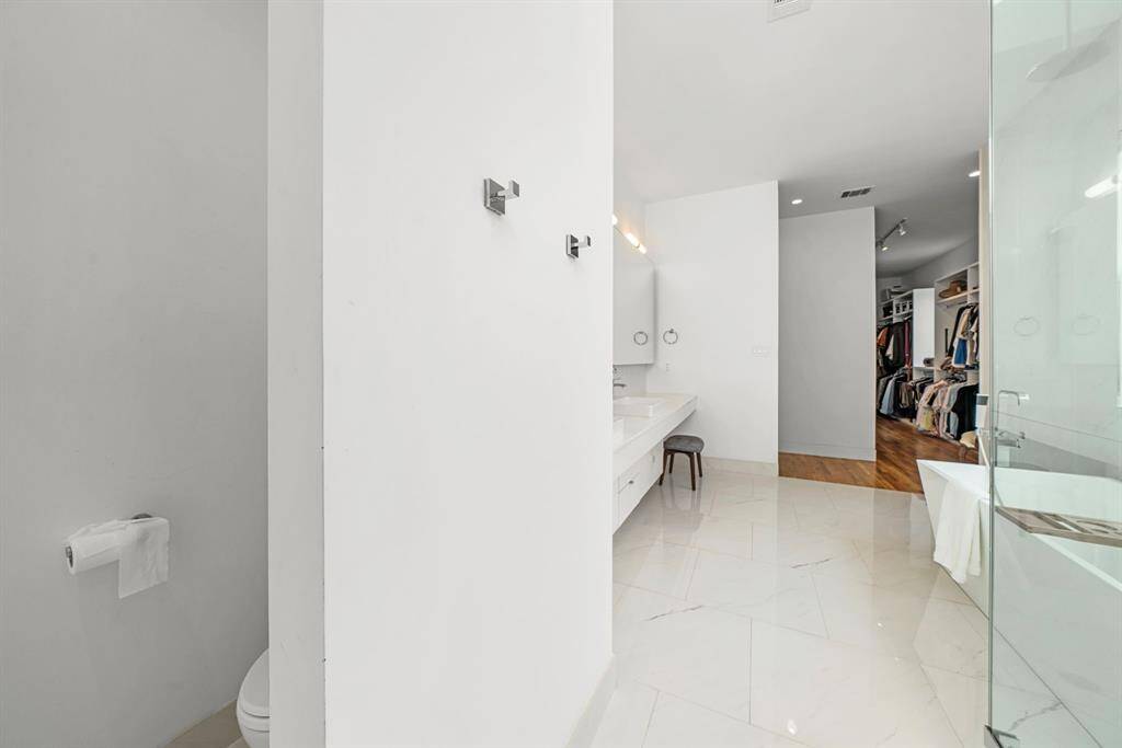 Private water closet at the back of the primary bathroom.