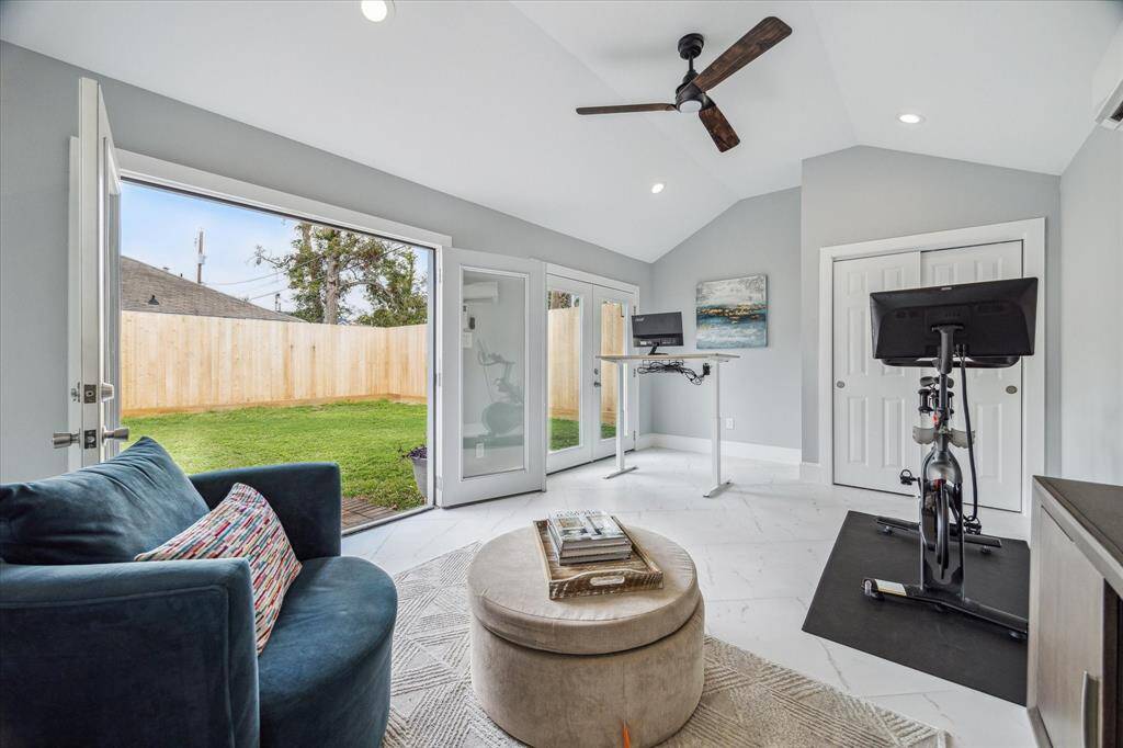 An amazing guest suite/extra room is located behind the main house. Outfitted with two French doors, tile floors, closet, and mini split HVAC system, this space offers great versatility.