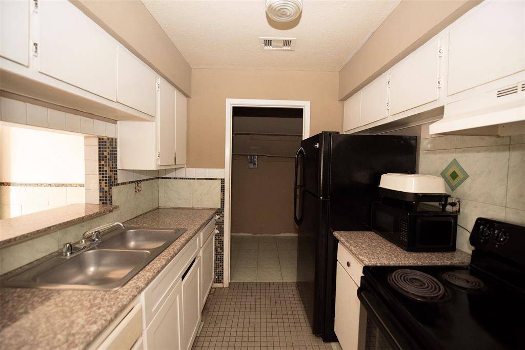 Kitchen with granite counters and great storage.