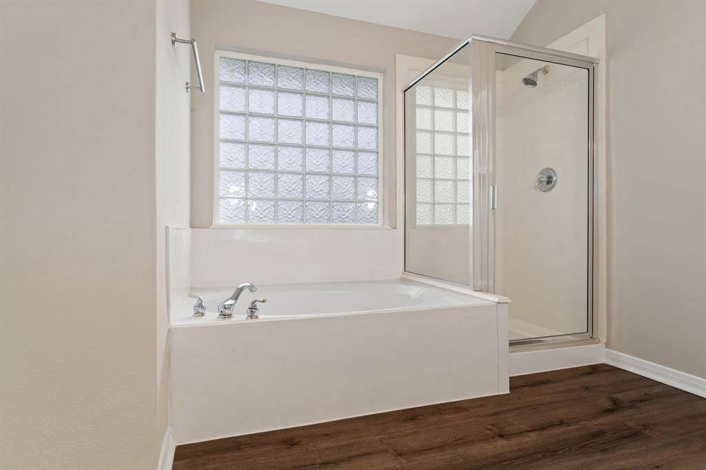The primary bathroom also includes a separate shower and jetted tub!