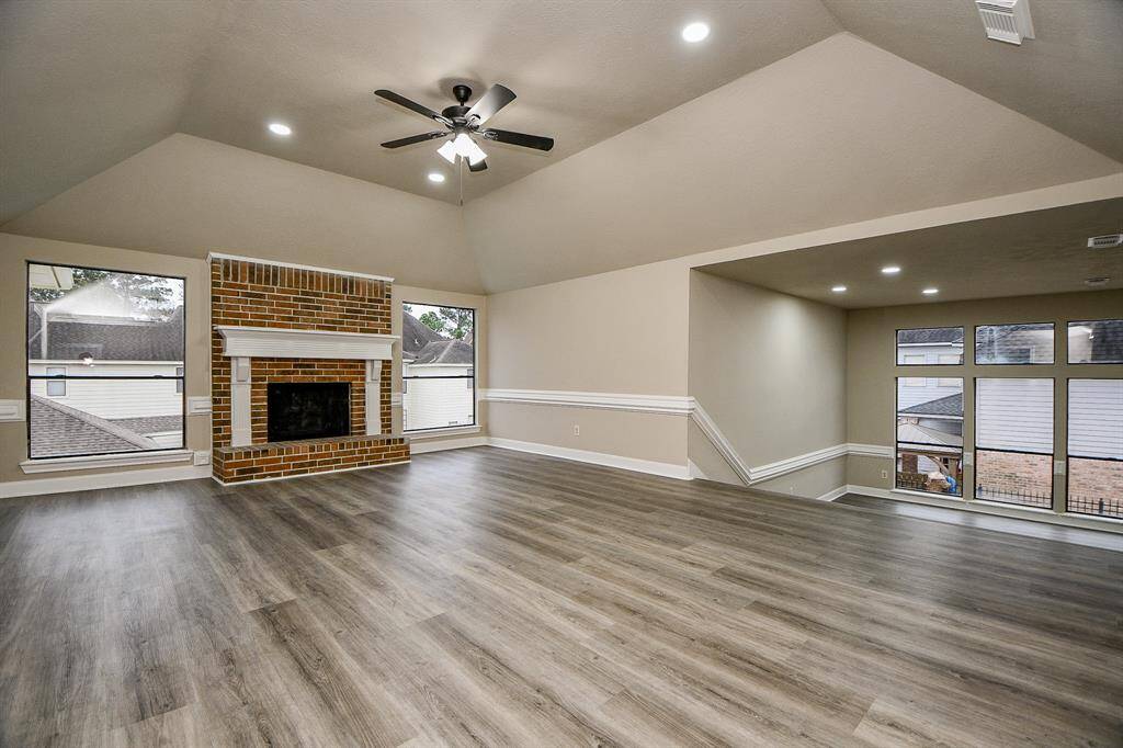 Imagine the grand entrance you'll make as you descend the elegant staircase, overlooking the impressive foyer below. This vantage point showcases the home's dramatic architecture and creates a sense of arrival!