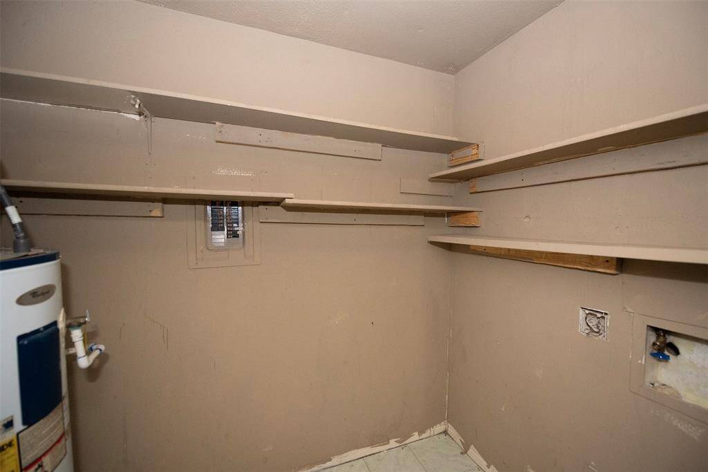 End of the kitchen is a pantry/utility area. Great storage for your dry and canned goods.