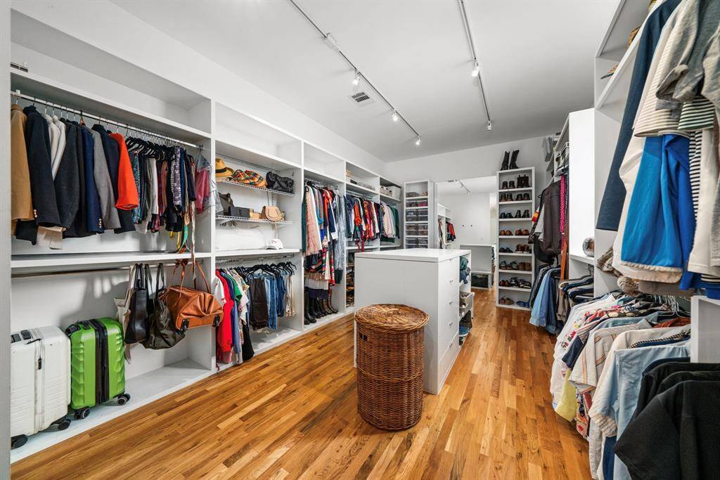 CHECK OUT THE SIZE OF THE PRIMARY BEDROOM CLOSET! This is almost a room of its own! Multiple built-in nooks for hanging clothes, as well as space for shoes, drawers and shelf storage.
