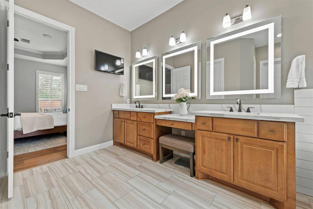 Secondary bedroom with patio access for guests, office space or workout room conveniently located on the main level