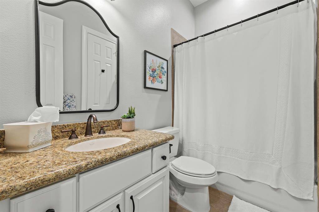 Laundry room off of one car garage/workout space
