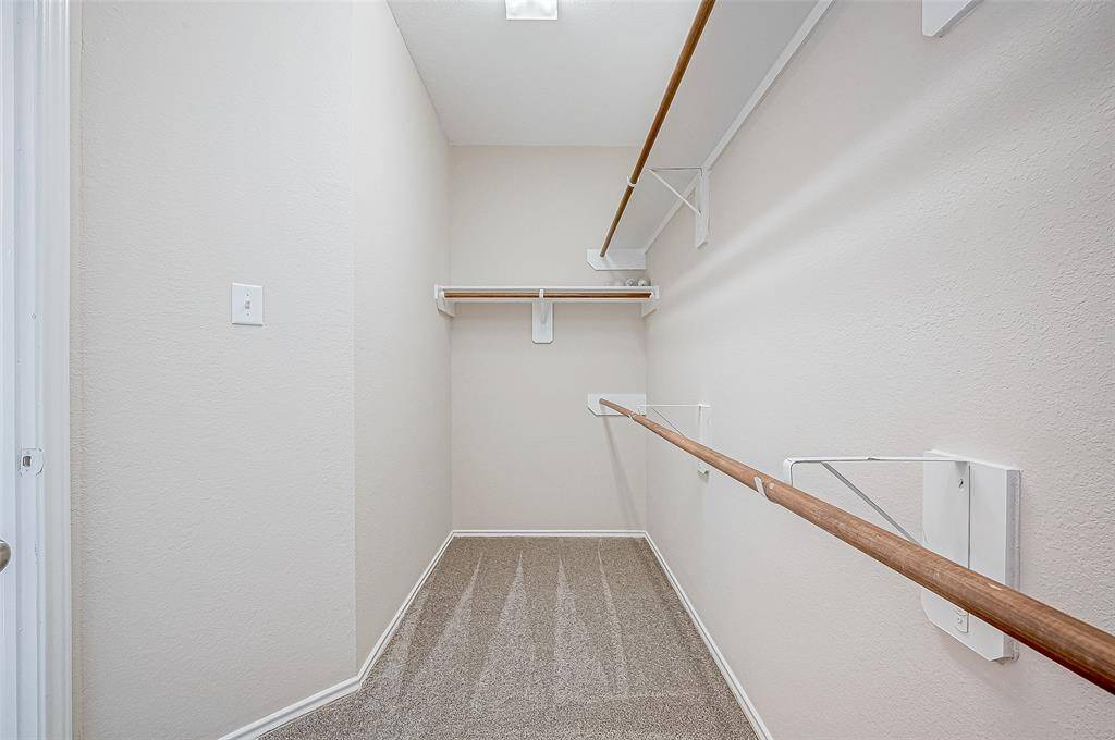 The walk-in closet with BRAND-NEW carpet is spacious and thoughtfully designed with multiple hanging rods and shelving, providing ample storage for all your wardrobe and organizational needs. Its efficient layout maximizes functionality while maintaining a clean and open feel.