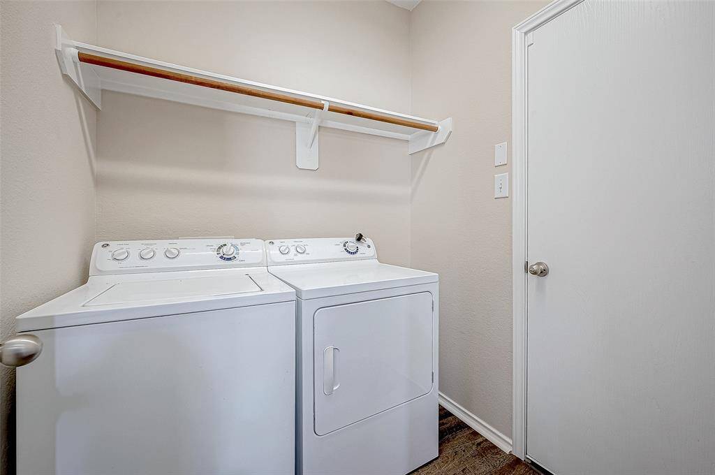 The utility room has new vinyl-plank flooring, and a built-in shelf to provide extra storage for your laundry essentials, keeping the space tidy and organized. With easy access and a functional layout, this room simplifies daily living.