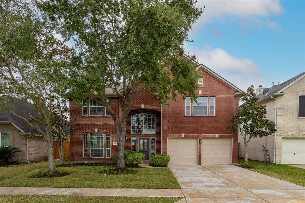Another view of the beautiful front yard and front elevation!