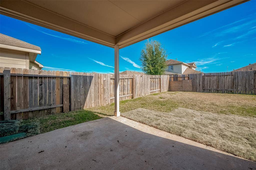 The backyard offers a cozy, covered patio area that opens up to a fully fenced yard, creating a private and serene outdoor space. The yard is versatile, perfect for gardening, pets, or outdoor play, with plenty of room for activities and relaxation. A wonderful spot to enjoy sunny afternoons or evening breezes!