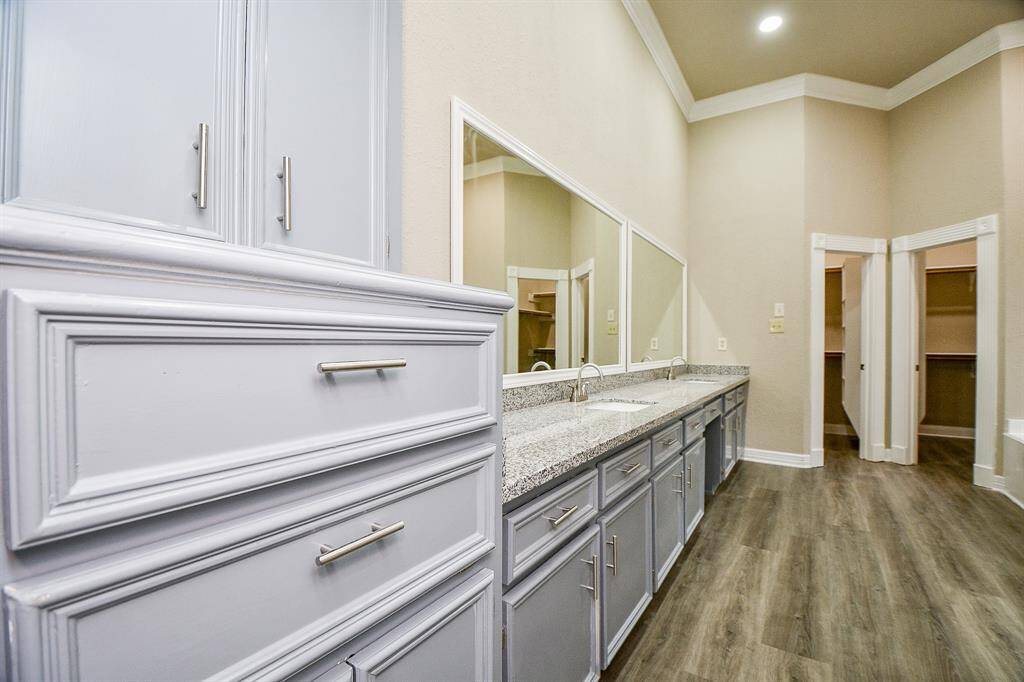 Just off the inviting loft area, a hallway leads to two generously sized bedrooms, offering privacy and flexibility. These bedrooms share a convenient Jack and Jill bathroom, making it ideal for guests or family members.