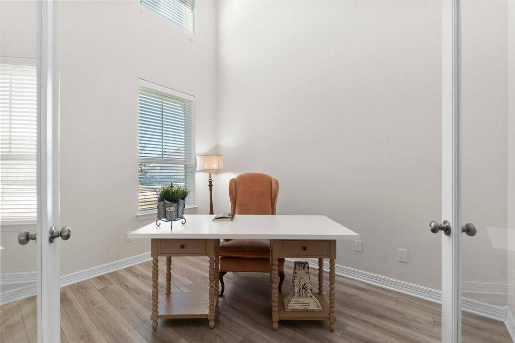 Home office with French doors and high ceilings
