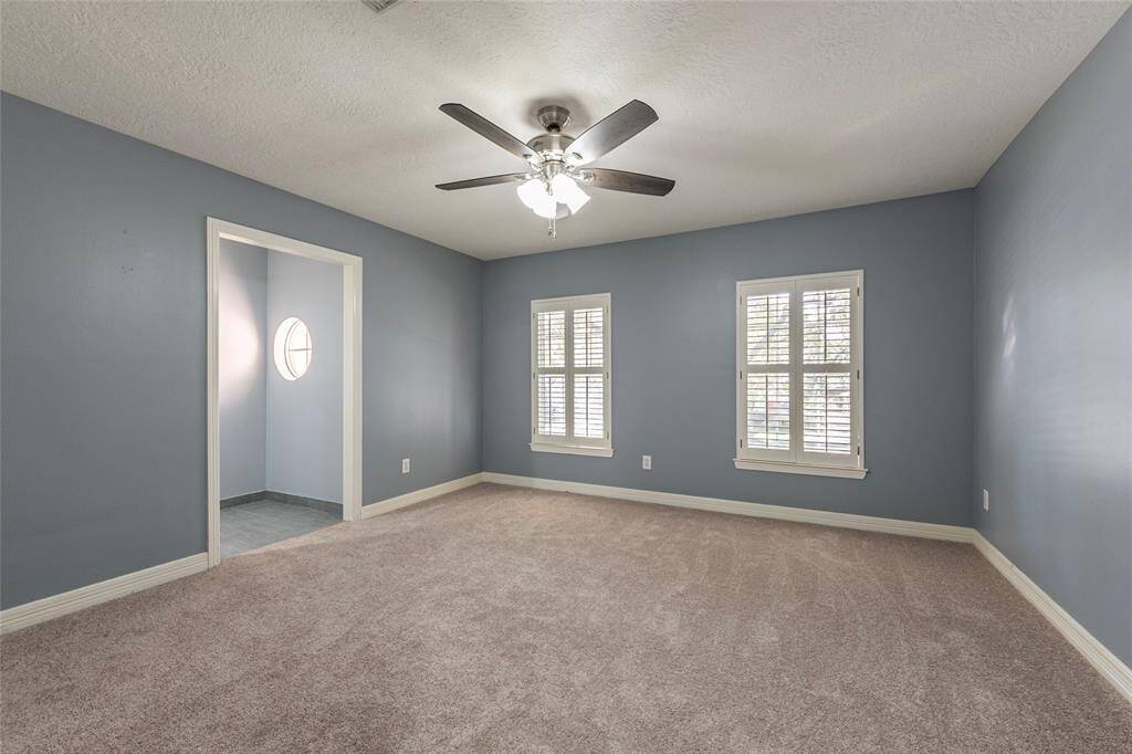 2nd bedroom is spacious with NEW carpet, Plantation shutters, updated ceiling fan and walk-in closet.
